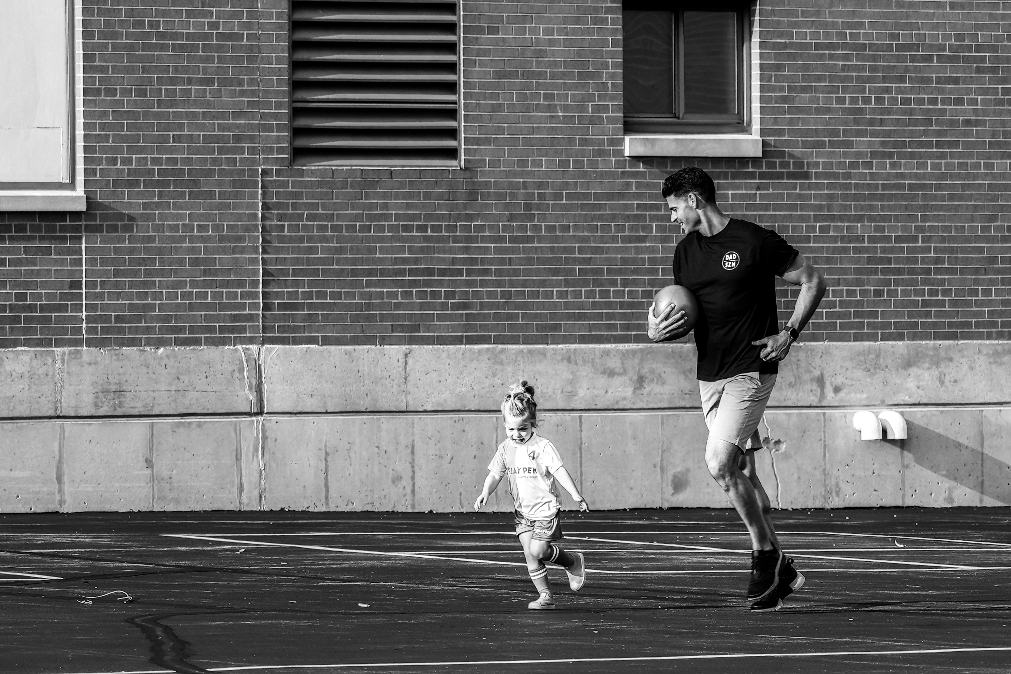 father daughter running having fun